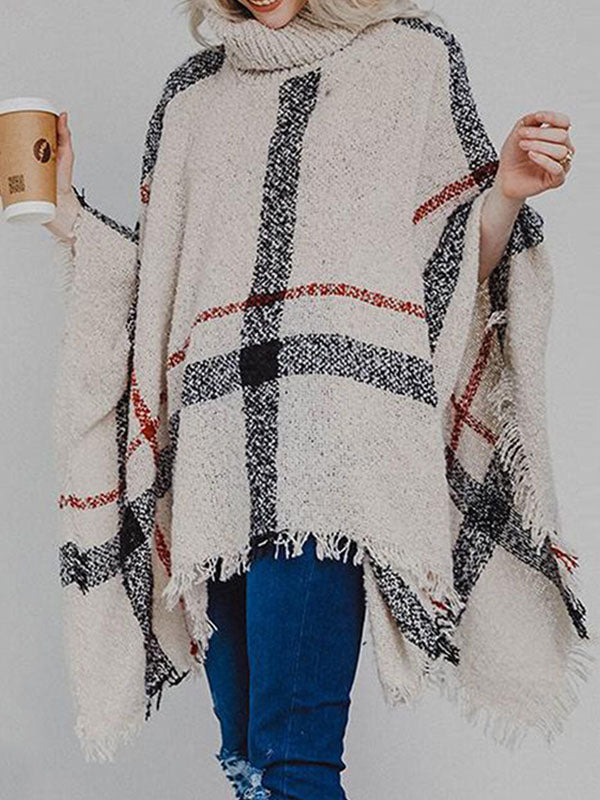 Poncho de punto con borlas y cuello alto a cuadros